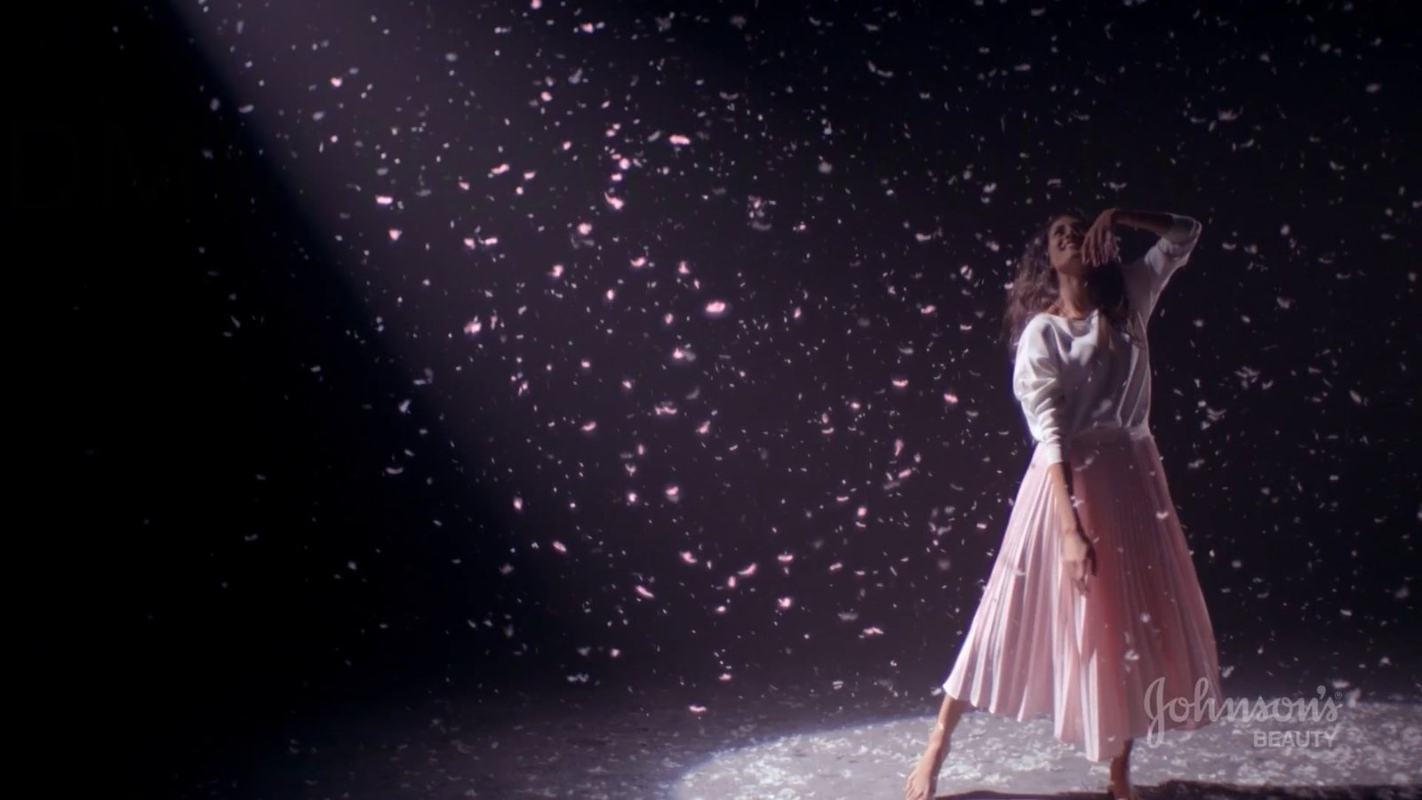 Pink fabric and floating petals in Dan Mitre’s beauty reel